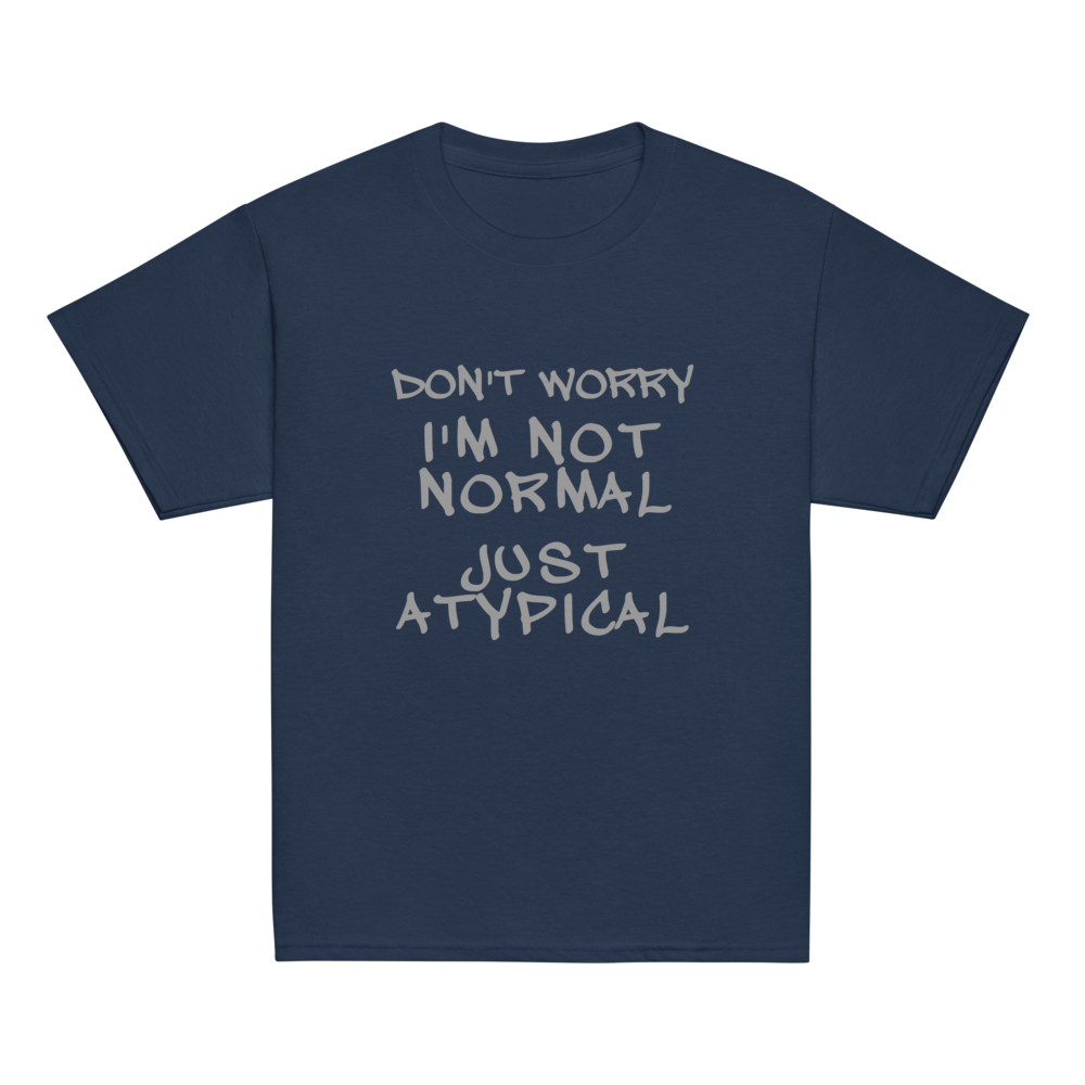 "Don't Worry I'm Not Normal Just Atypical" printed on a navy youth classic tee laying on a flat surface