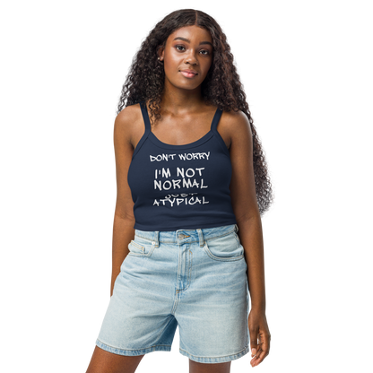 "Don't Worry I'm Not Normal Just Atypical" printed on a solid navy blend women's micro-rib tanktop worn by a female