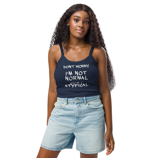 "Don't Worry I'm Not Normal Just Atypical" printed on a solid navy blend women's micro-rib tanktop worn by a female