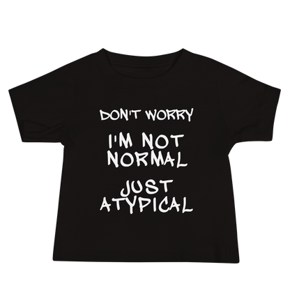 "Don't Worry I'm Not Normal Just Atypical" printed on a black baby jersey short sleeve tee laying on a flat surface