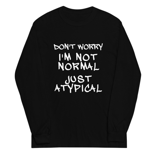 "Don't Worry I'm Not Normal Just Atypical" printed on a black men's long sleeve shirt laying on a flat surface