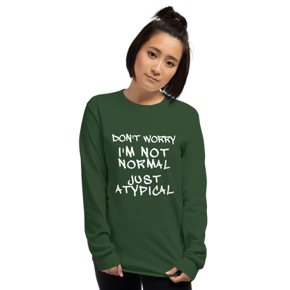 "Don't Worry I'm Not Normal Just Atypical" printed on a forest green men's long sleeve shirt worn by a female