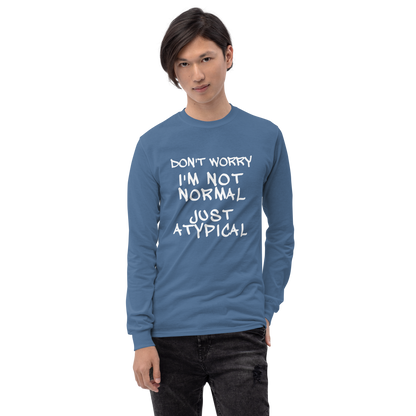 "Don't Worry I'm Not Normal Just Atypical" printed on a indigo blue men's long sleeve shirt worn by a male