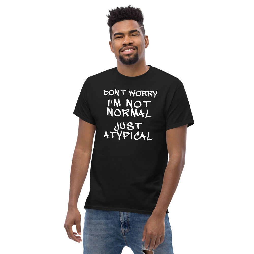 "Don't Worry I'm Not Normal Just Atypical" printed on a black unisex classic tee worn by a male