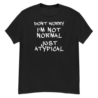 "Don't Worry I'm Not Normal Just Atypical" printed on a black unisex classic tee laying on a flat surface