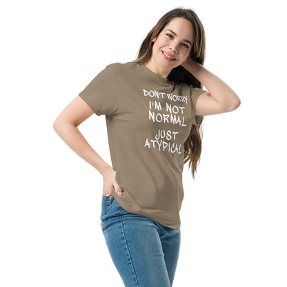 "Don't Worry I'm Not Normal Just Atypical" printed on a brown savana unisex classic tee worn by a female