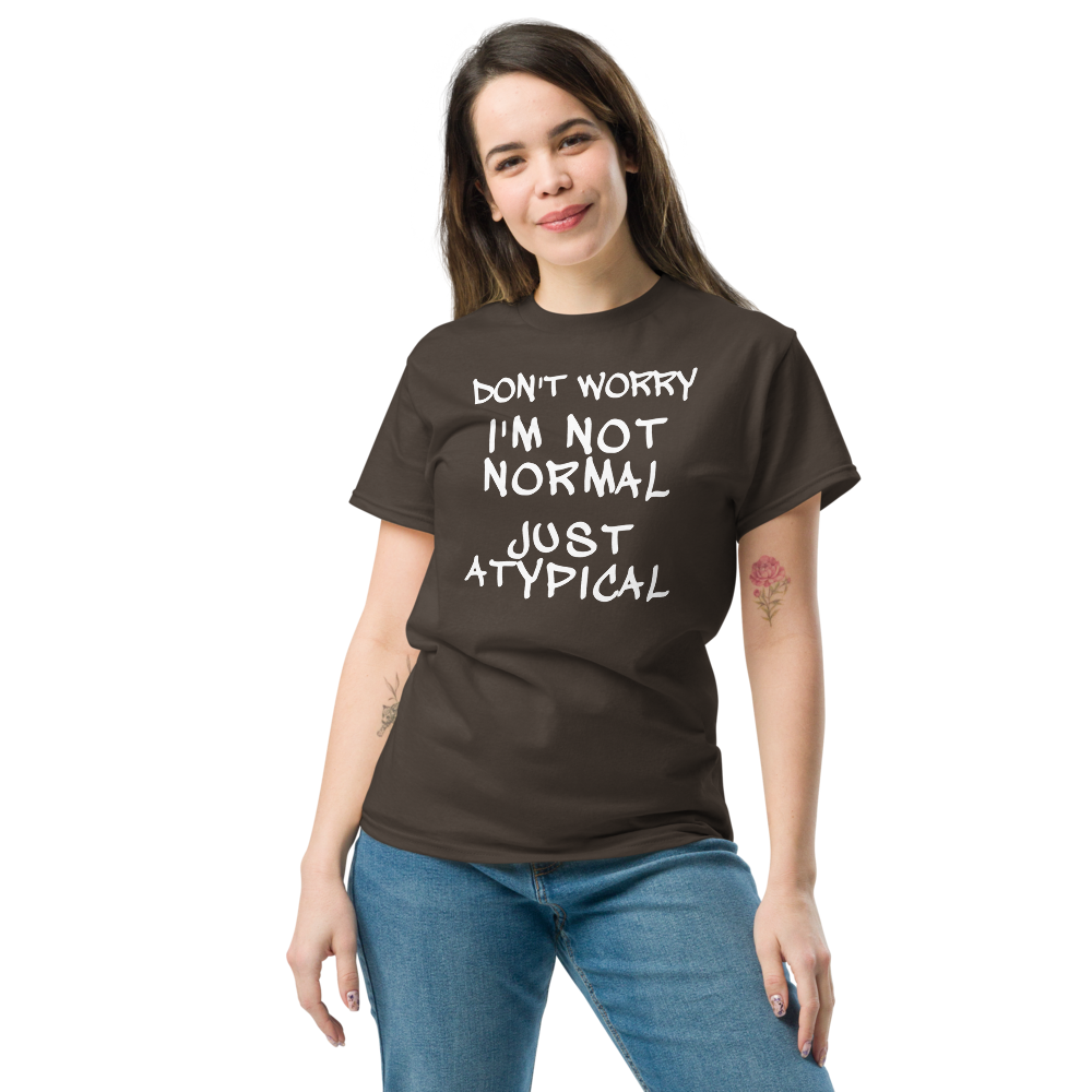 "Don't Worry I'm Not Normal Just Atypical" printed on a dark chocolate unisex classic tee worn by a female
