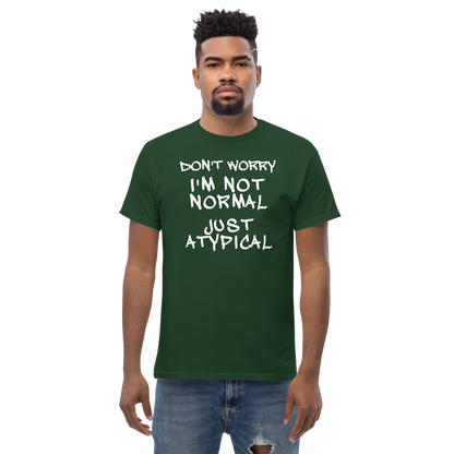 "Don't Worry I'm Not Normal Just Atypical" printed on a forest green unisex classic tee worn by a male