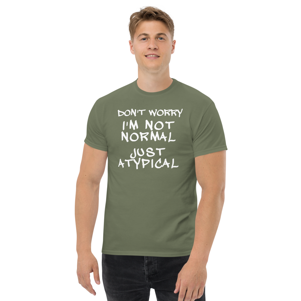 "Don't Worry I'm Not Normal Just Atypical" printed on a military green unisex classic tee worn by a male