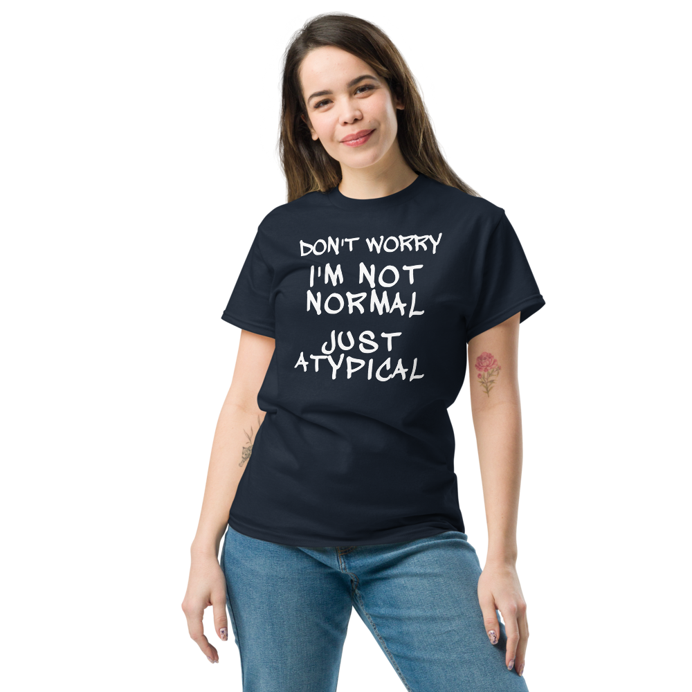"Don't Worry I'm Not Normal Just Atypical" printed on a navy unisex classic tee worn by a female
