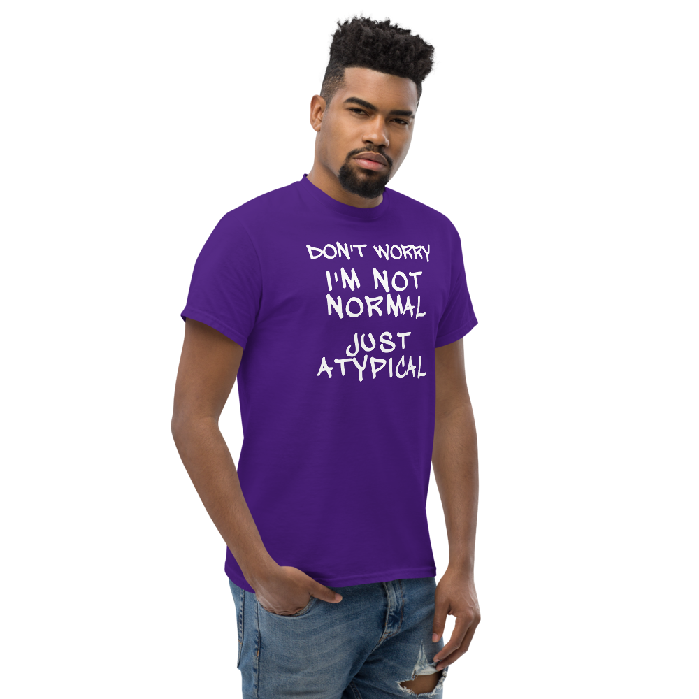 "Don't Worry I'm Not Normal Just Atypical" printed on a purple unisex classic tee worn by a male