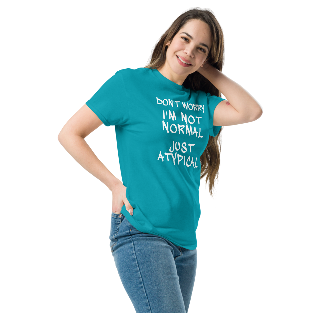 "Don't Worry I'm Not Normal Just Atypical" printed on a tropical blue unisex classic tee worn by a female