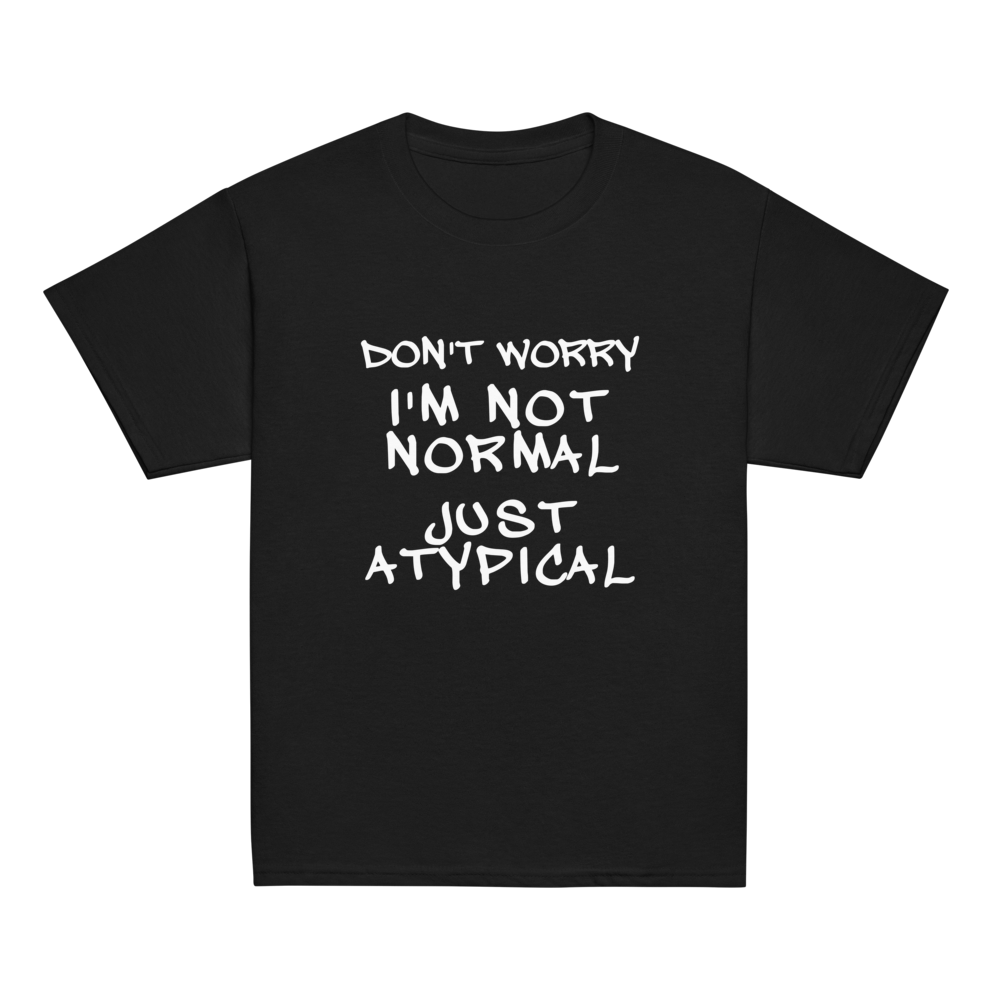 "Don't Worry I'm Not Normal Just Atypical" printed on a black youth classic tee laying on a flat surface