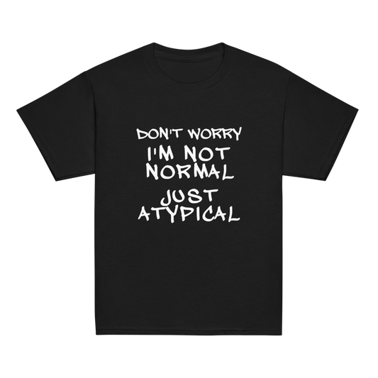 "Don't Worry I'm Not Normal Just Atypical" printed on a black youth classic tee laying on a flat surface