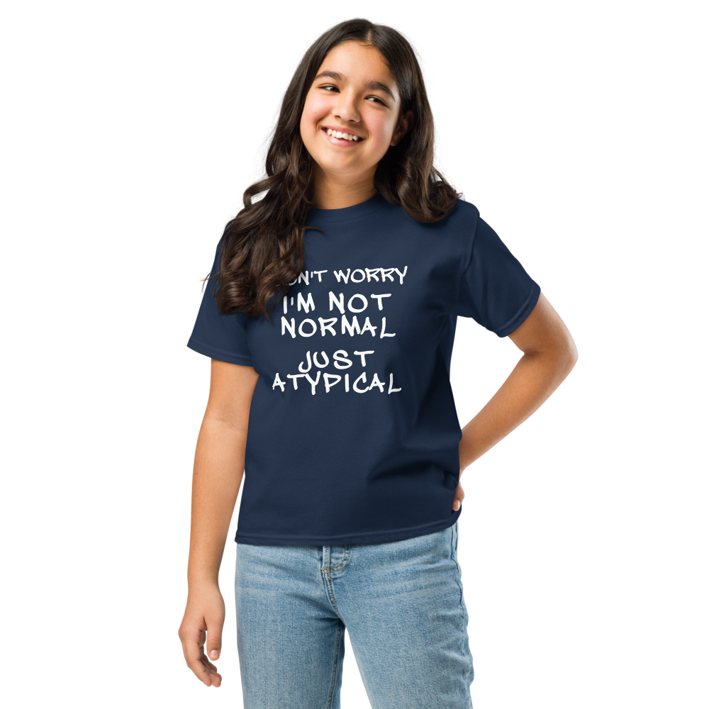 "Don't Worry I'm Not Normal Just Atypical" printed on a navy youth classic tee worn by a female