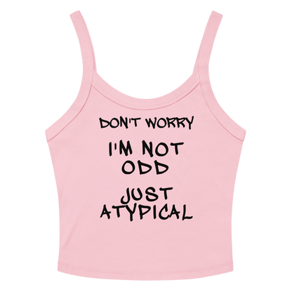 "Don't Worry I'm Not Odd Just Atypical" printed on a solid pink blend women's micro-rib tanktop laying on a flat surface amongst sunglasses and shorts