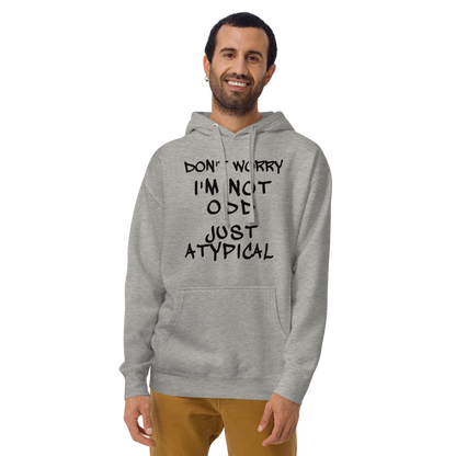 "Don't Worry I'm Not Odd Just Atypical" printed on a carbon grey warn by a male