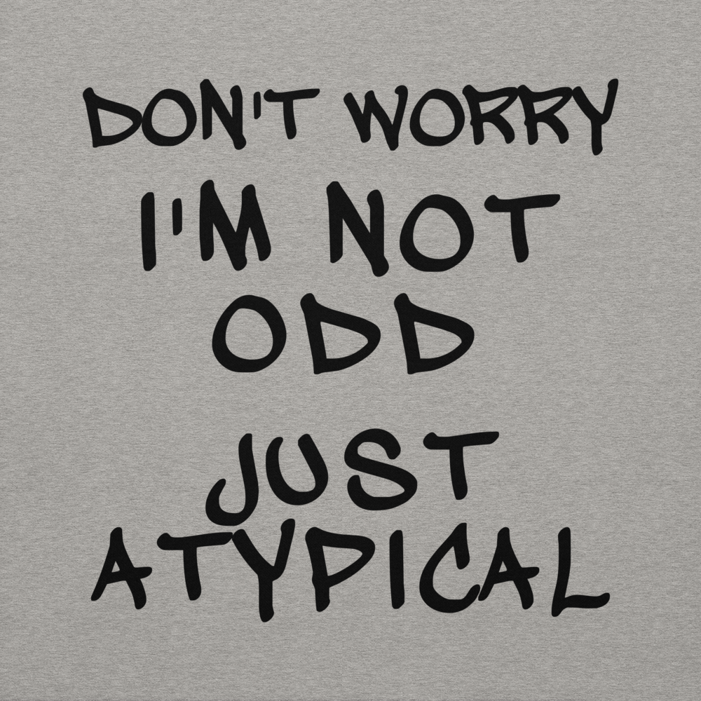 "Don't Worry I'm Not Odd Just Atypical" printed on a carbon grey background