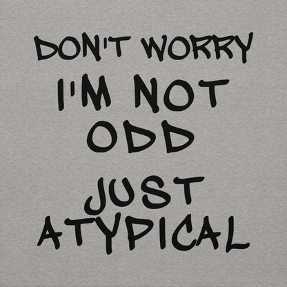 "Don't Worry I'm Not Odd Just Atypical" printed on a carbon grey background
