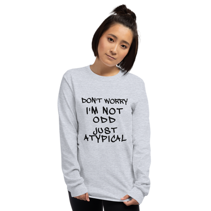 "Don't Worry I'm Not Odd Just Atypical" printed on a sport grey men's long sleeve shirt worn by a female