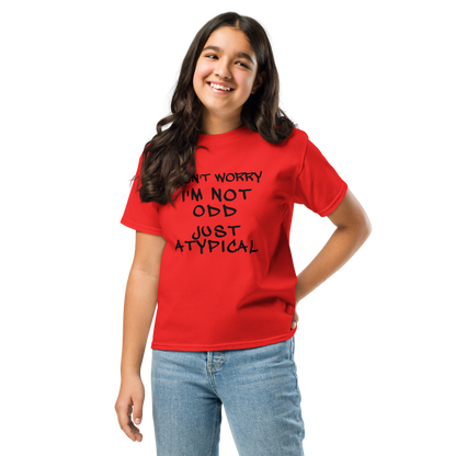"Don't Worry I'm Not Odd Just Atypical" printed on a red youth classic tee worn by a female