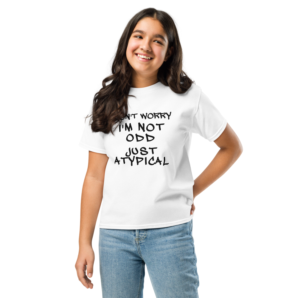 "Don't Worry I'm Not Odd Just Atypical" printed on a white youth classic tee worn by a female
