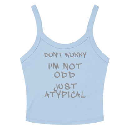 "Don't Worry I'm Not Odd Just Atypical" printed on a solid baby blue blend women's micro-rib tanktop laying on a flat surface amongst sunglasses and shorts
