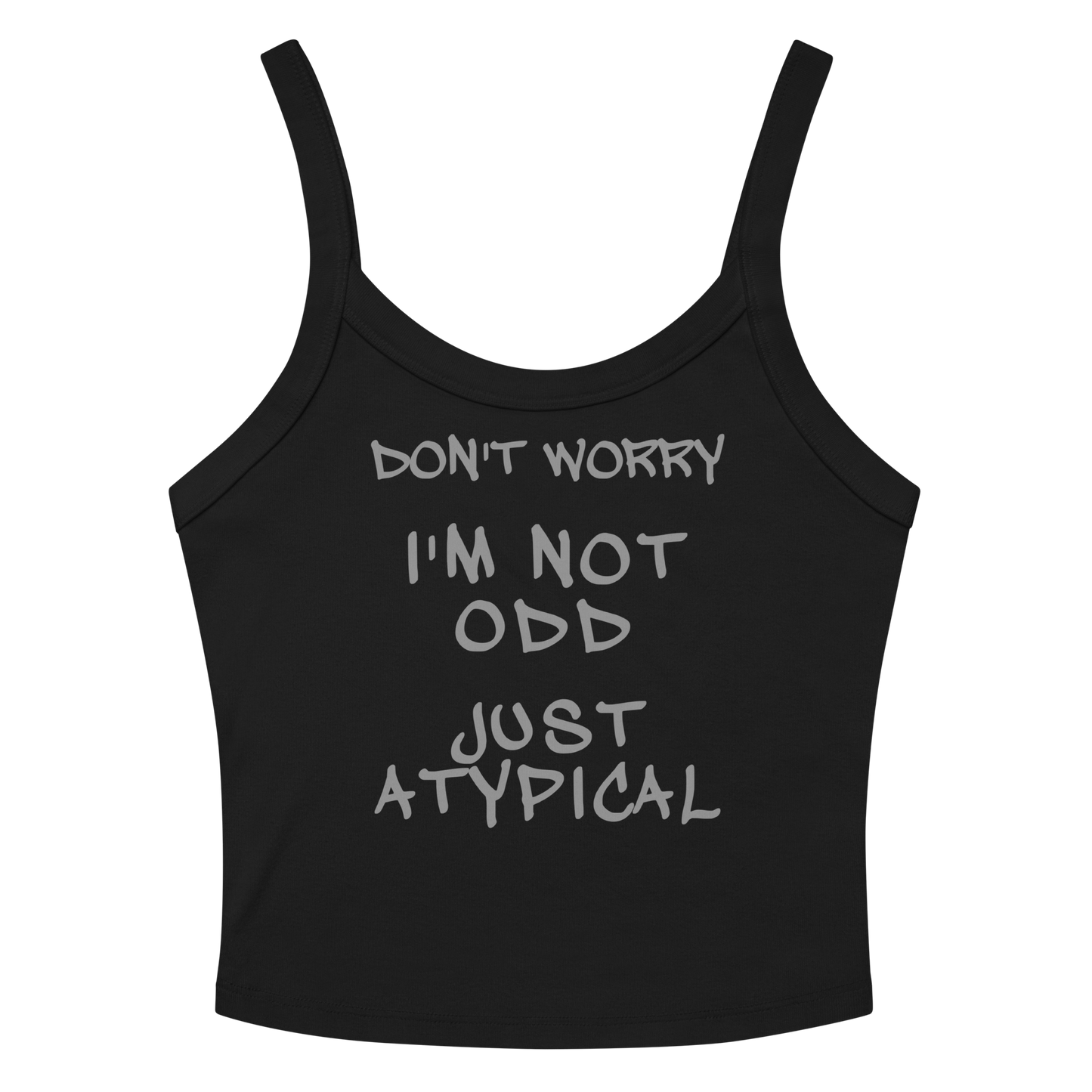 "Don't Worry I'm Not Odd Just Atypical" printed on a solid black blend women's micro-rib tanktop laying on a flat surface amongst sunglasses and shorts