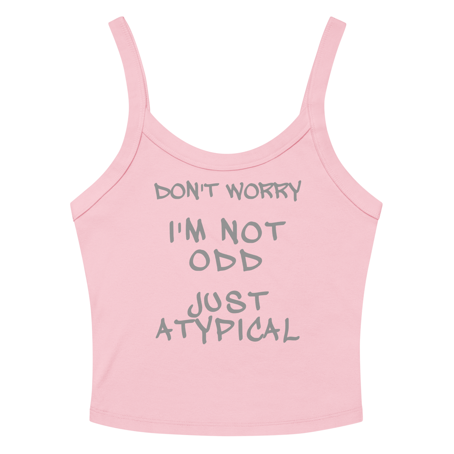 "Don't Worry I'm Not Odd Just Atypical" printed on a solid pink blend women's micro-rib tanktop laying on a flat surface amongst sunglasses and shorts