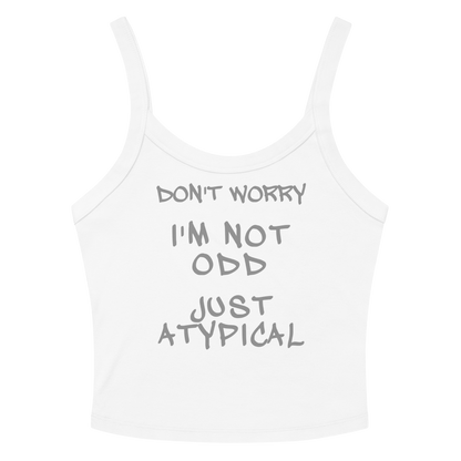 "Don't Worry I'm Not Odd Just Atypical" printed on a solid white blend women's micro-rib tanktop laying on a flat surface amongst sunglasses and shorts
