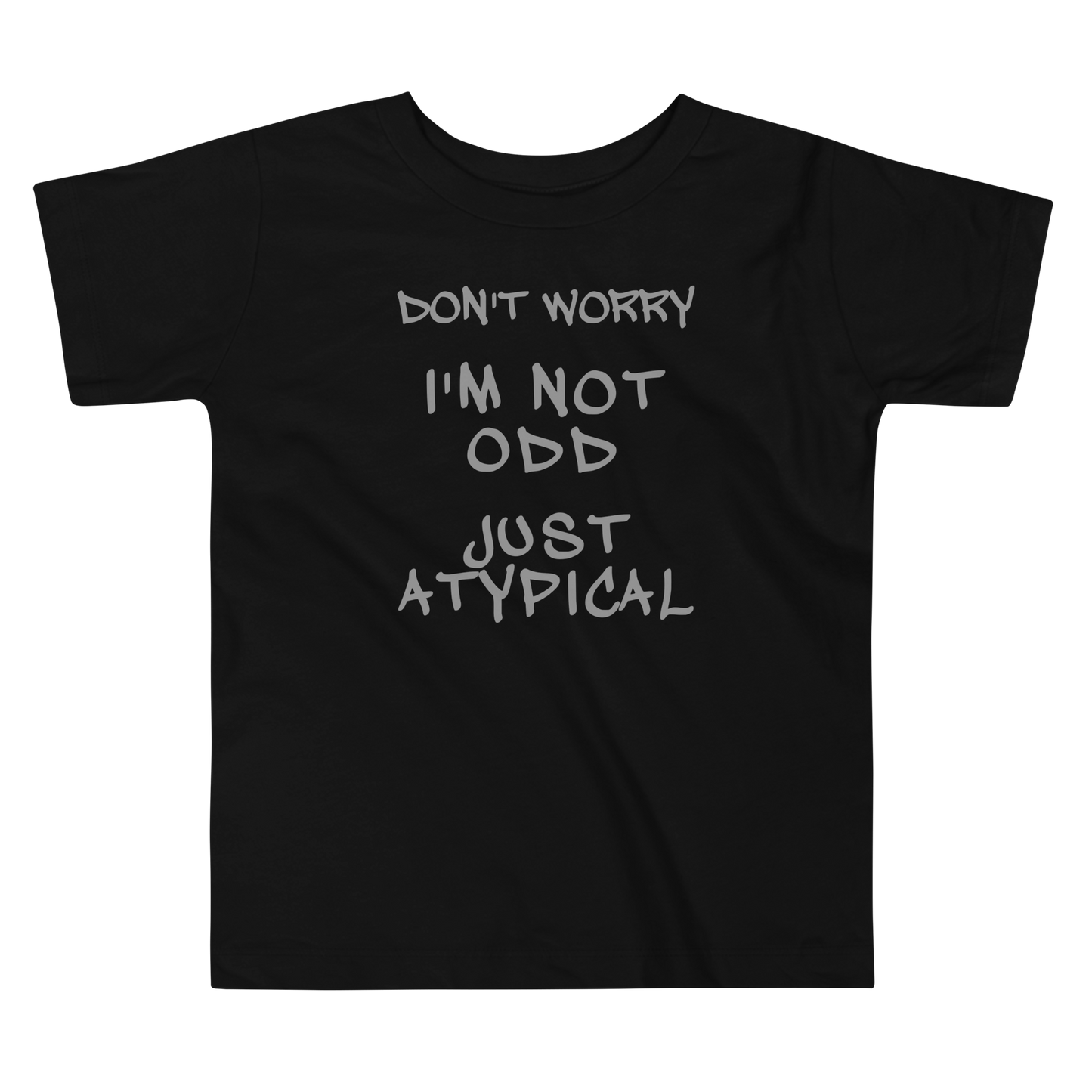 "Don't Worry I'm Not Odd Just Atypical" printed on a black toddler short sleeve tee laying on a flat surface