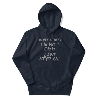 "Don't Worry I'm Not Odd Just Atypical" printed on a navy blazer unisex hoodie laying on a flat surface with the hood up