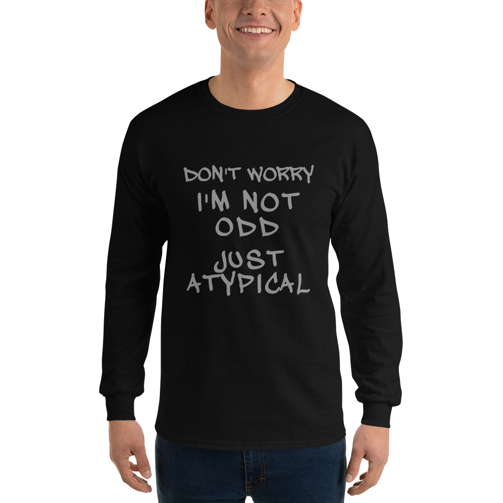 "Don't Worry I'm Not Odd Just Atypical" printed on a black men's long sleeve shirt worn by a male