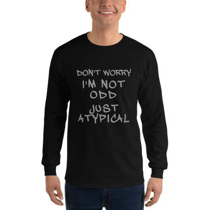 "Don't Worry I'm Not Odd Just Atypical" printed on a black men's long sleeve shirt worn by a male