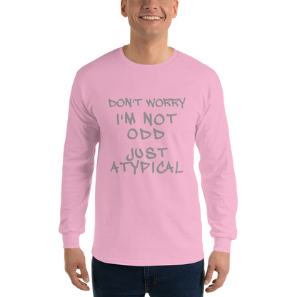"Don't Worry I'm Not Odd Just Atypical" printed on a light pink men's long sleeve shirt worn by a male