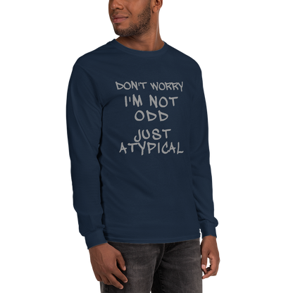"Don't Worry I'm Not Odd Just Atypical" printed on a navy men's long sleeve shirt worn by a male