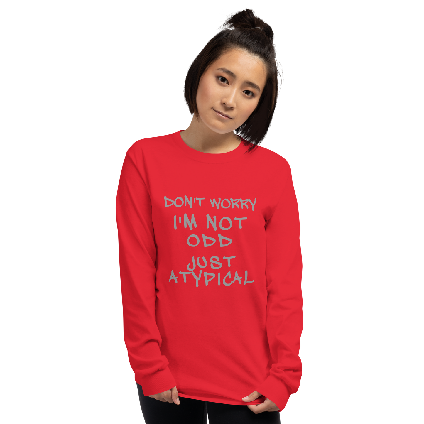 "Don't Worry I'm Not Odd Just Atypical" printed on a red men's long sleeve shirt worn by a female