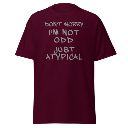 "Don't Worry I'm Not Odd Just Atypical" printed on a maroon on an invisible body