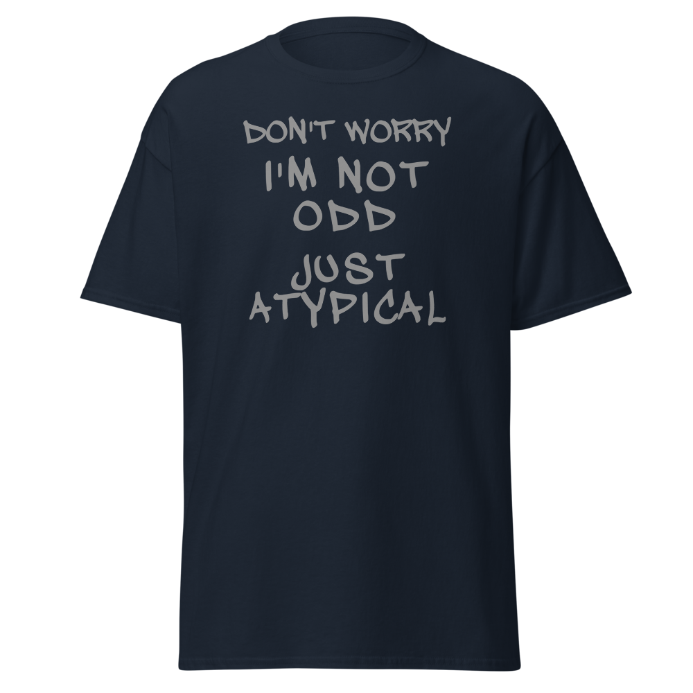 "Don't Worry I'm Not Odd Just Atypical" printed on a navy unisex classic tee laying on a flat surface