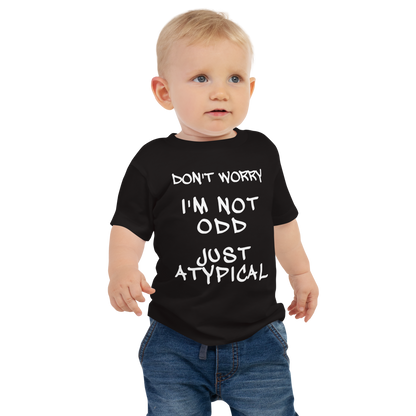 "Don't Worry I'm Not Odd Just Atypical" printed on a black baby jersey short sleeve tee worn by a male