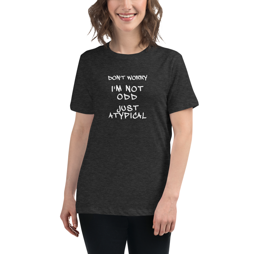 "Don't Worry I'm Not Odd Just Atypical" printed on a dark grey heather women's relaxed t-shirt worn by a female