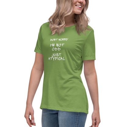 "Don't Worry I'm Not Odd Just Atypical" printed on a leaf women's relaxed t-shirt worn by a female
