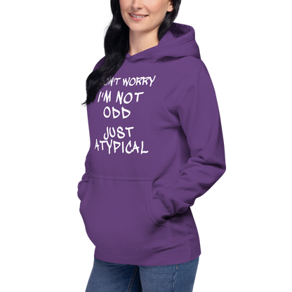 "Don't Worry I'm Not Odd Just Atypical" printed on a purple unisex hoodie worn by a female
