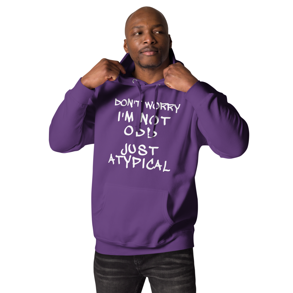 "Don't Worry I'm Not Odd Just Atypical" printed on a purple unisex hoodie worn by a male