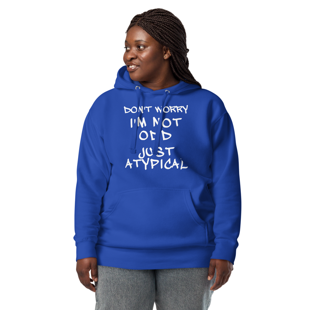 "Don't Worry I'm Not Odd Just Atypical" printed on a team royal unisex hoodie worn by a female