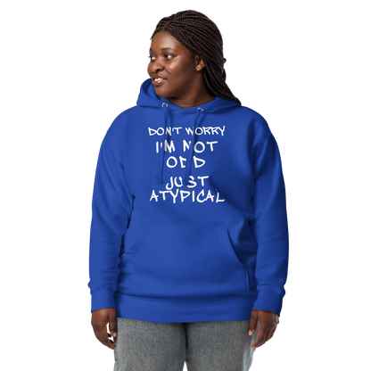 "Don't Worry I'm Not Odd Just Atypical" printed on a team royal unisex hoodie worn by a female