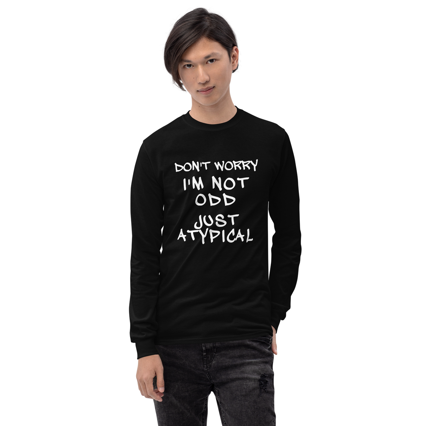 "Don't Worry I'm Not Odd Just Atypical" printed on a black men's long sleeve shirt worn by a male