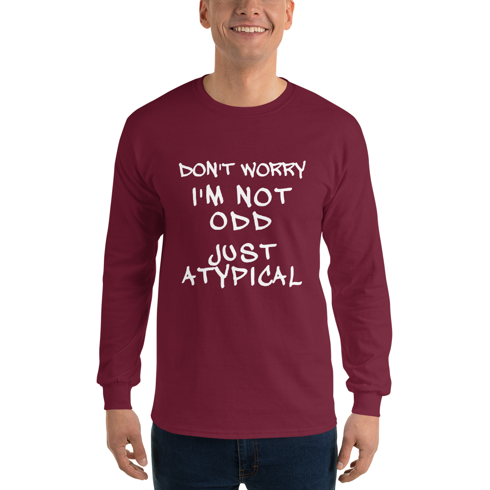 "Don't Worry I'm Not Odd Just Atypical" printed on a maroon men's long sleeve shirt worn by a male