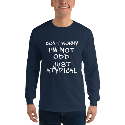 "Don't Worry I'm Not Odd Just Atypical" printed on a navy men's long sleeve shirt worn by a male