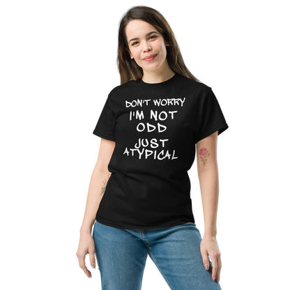 "Don't Worry I'm Not Odd Just Atypical" printed on a black unisex classic tee worn by a female